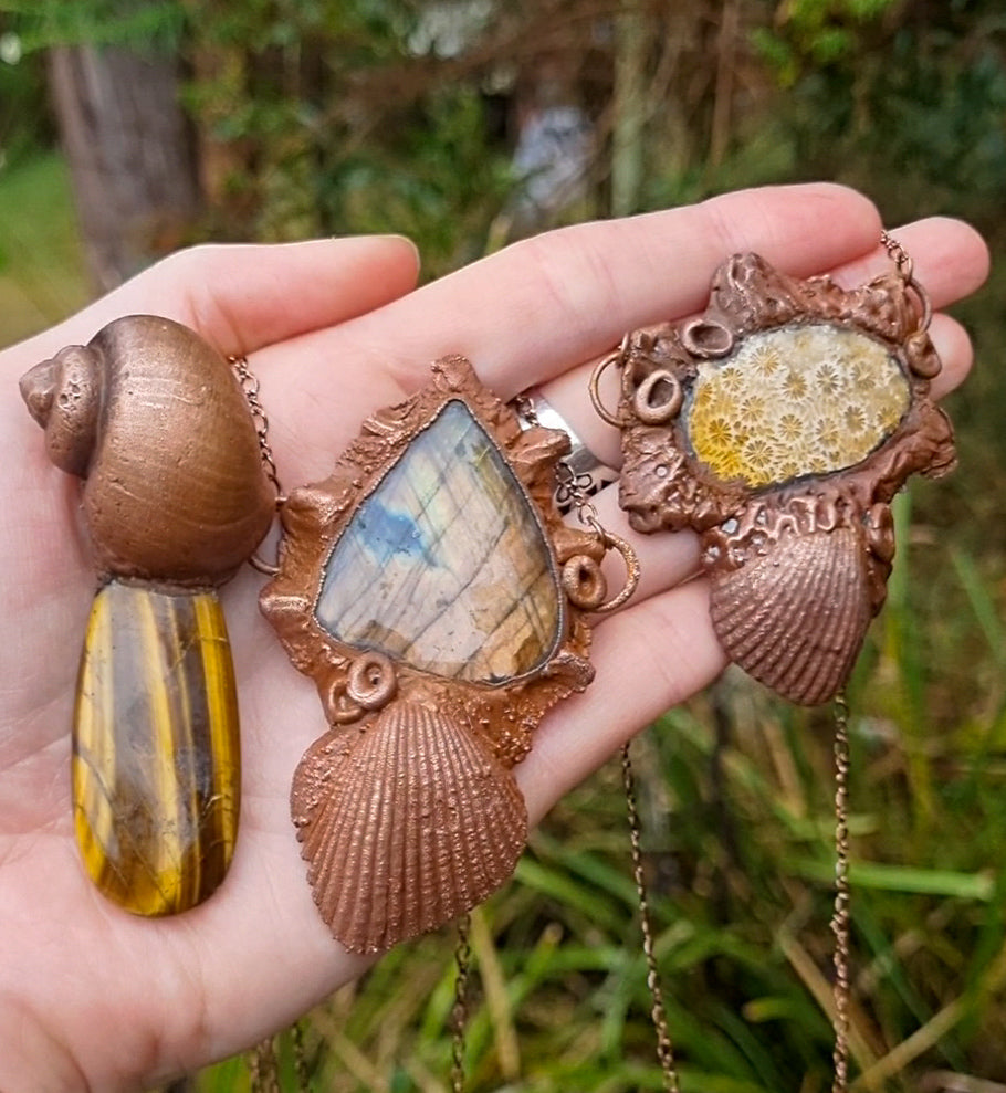 Seashell copper electroformed pendant with fossilised coral