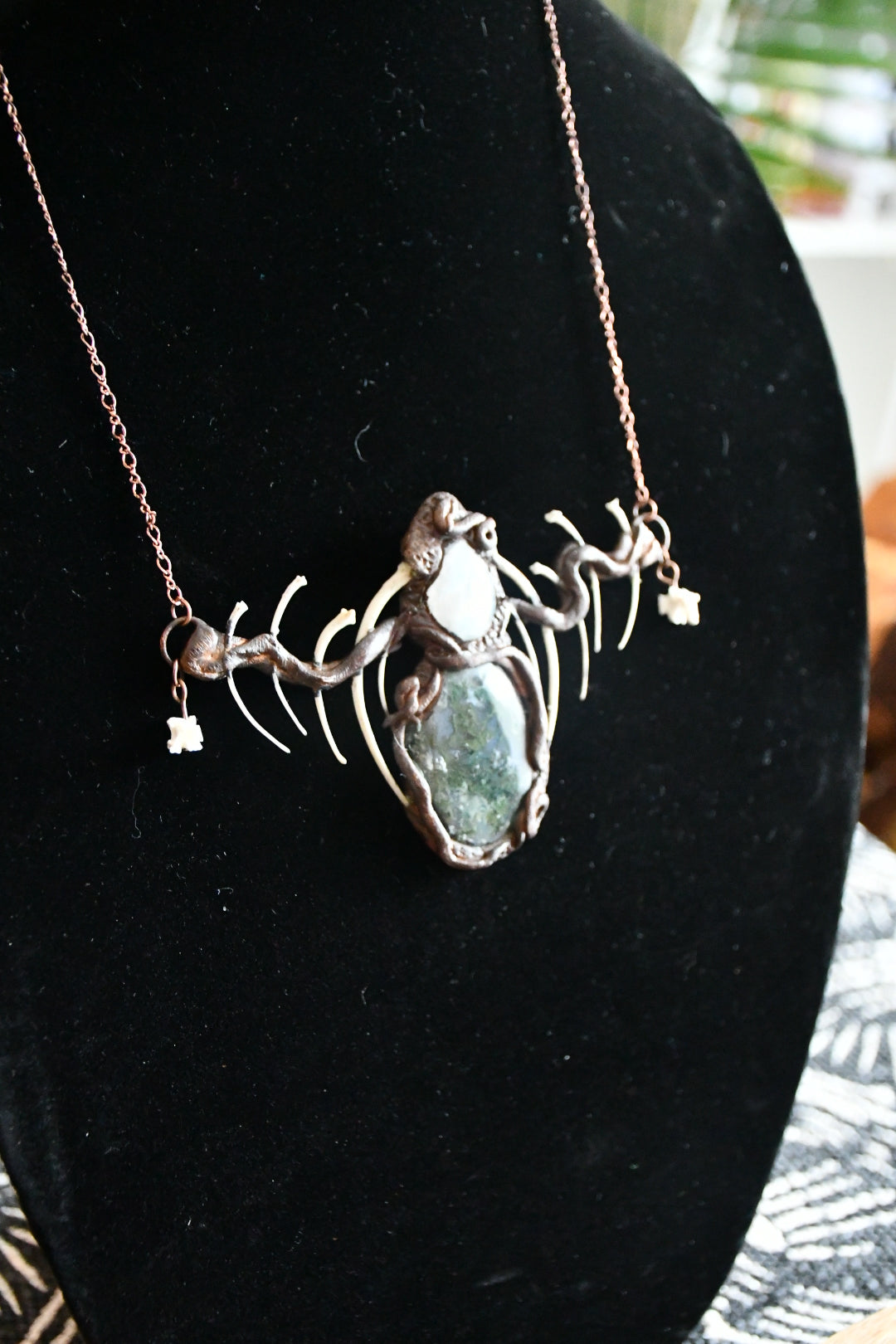 Cloud Forest: Snake skeleton, moss agate, and moonstone copper electroformed necklace