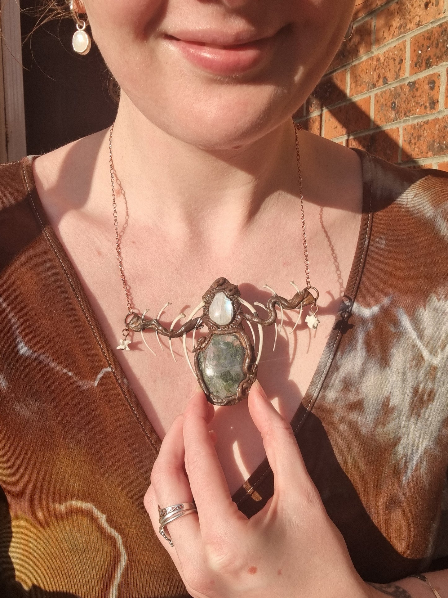Cloud Forest: Snake skeleton, moss agate, and moonstone copper electroformed necklace